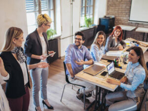 Business colleagues in conference meeting room during presentation